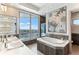 Luxurious bathroom with dual vanities, soaking tub, mosaic art, and stunning waterfront views at 1209 E Cumberland Ave # 2802, Tampa, FL 33602