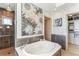 Modern bathroom with soaking tub, walk-in shower, and stylish decor at 1209 E Cumberland Ave # 2802, Tampa, FL 33602