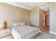 Neutral bedroom with a comfortable bed, side tables, decor, and soft lighting at 1209 E Cumberland Ave # 2802, Tampa, FL 33602