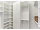 Bright walk-in closet with custom shelving and storage solutions, offering ample space at 1209 E Cumberland Ave # 2802, Tampa, FL 33602