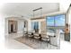 Dining room with contemporary chandelier, and floor-to-ceiling window and city views at 1209 E Cumberland Ave # 2802, Tampa, FL 33602