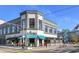 Street view of Jotoro restaurant with outdoor seating in a gray building with a blue awning and cruise ship in the background at 1209 E Cumberland Ave # 2802, Tampa, FL 33602