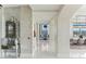 Bright hallway with marble floors leading to dining area and living space with an eye-catching city view at 1209 E Cumberland Ave # 2802, Tampa, FL 33602