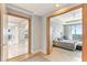 Open doorway that reveals a hallway and bedroom; both areas are illuminated by city views at 1209 E Cumberland Ave # 2802, Tampa, FL 33602