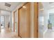 Hallway with light wood floors and doors leading to different rooms with a great view in the distance at 1209 E Cumberland Ave # 2802, Tampa, FL 33602