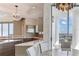 Gourmet kitchen features a large island, modern appliances, and stylish decor with dining area at 1209 E Cumberland Ave # 2802, Tampa, FL 33602