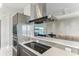 Open-concept kitchen with stainless steel appliances, quartz countertops, and an open floor plan view at 1209 E Cumberland Ave # 2802, Tampa, FL 33602
