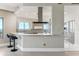 Open-concept kitchen with a breakfast bar, modern appliances, and stylish lighting at 1209 E Cumberland Ave # 2802, Tampa, FL 33602