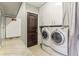 Well-equipped laundry room with washer, dryer, ample cabinet space, and convenient access to a closet at 1209 E Cumberland Ave # 2802, Tampa, FL 33602