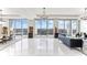 Bright living room featuring tile floors, modern chandeliers, and stunning views from floor-to-ceiling windows at 1209 E Cumberland Ave # 2802, Tampa, FL 33602