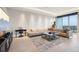 Bright living room featuring a sectional sofa, entertainment center, and city views at 1209 E Cumberland Ave # 2802, Tampa, FL 33602
