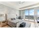 Bright, spacious main bedroom with balcony access and stunning water view at 1209 E Cumberland Ave # 2802, Tampa, FL 33602