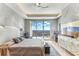 Spacious main bedroom with balcony access and beautiful water views and ceiling fan at 1209 E Cumberland Ave # 2802, Tampa, FL 33602