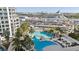 Large and luxurious pool with a bridge, palm trees, and a view of a cruise ship at 1209 E Cumberland Ave # 2802, Tampa, FL 33602