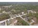 An aerial view of a charming neighborhood with well-spaced homes nestled among the trees at 12341 Filbert Rd, Weeki Wachee, FL 34614