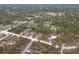 Neighborhood aerial view highlighting a cozy residence surrounded by tree-lined streets and other single Gathering homes at 12341 Filbert Rd, Weeki Wachee, FL 34614