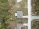 Aerial view of the property showcases its well-maintained lawn, simple roofline and proximity to neighborhood amenities at 12341 Filbert Rd, Weeki Wachee, FL 34614