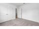 Cozy bedroom featuring double closets, doorway to an adjoining room, providing both comfort and convenience at 12341 Filbert Rd, Weeki Wachee, FL 34614