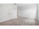 Bedroom featuring a double-door closet, neutral walls and soft carpet at 12341 Filbert Rd, Weeki Wachee, FL 34614