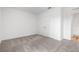 Comfortable bedroom featuring double closets, doorway to an adjoining room, providing both comfort and convenience at 12341 Filbert Rd, Weeki Wachee, FL 34614
