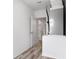 Hallway featuring modern flooring, doorways and a visible HVAC at 12341 Filbert Rd, Weeki Wachee, FL 34614