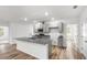 Open kitchen with island and stainless steel appliances at 12341 Filbert Rd, Weeki Wachee, FL 34614