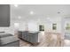 Spacious living room and kitchen features an open floor plan, lots of lights and modern appliances at 12341 Filbert Rd, Weeki Wachee, FL 34614