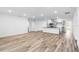 Spacious living room showcasing the open-concept design and modern flooring at 12341 Filbert Rd, Weeki Wachee, FL 34614