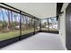 A screened in patio, with a view of lush greenery at 12341 Filbert Rd, Weeki Wachee, FL 34614