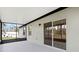Relax on the screened patio, complete with sliding door access to the home's interior, offering seamless indoor-outdoor living at 12341 Filbert Rd, Weeki Wachee, FL 34614