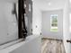 Utility room with modern flooring, an HVAC unit and a bright window at 12341 Filbert Rd, Weeki Wachee, FL 34614
