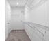 Walk-in closet with wire shelving, providing ample storage space and great organization for any homeowner at 12341 Filbert Rd, Weeki Wachee, FL 34614