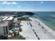 An aerial view showcasing the condo building's proximity to the beach and the draw bridge at 12924 Gulf Blvd # 503, Madeira Beach, FL 33708