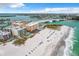 An aerial view showcasing the condo building's proximity to the beach, restaurants, and ocean at 12924 Gulf Blvd # 503, Madeira Beach, FL 33708