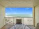 Enjoy breathtaking ocean views from the private balcony with comfortable seating and a table at 12924 Gulf Blvd # 503, Madeira Beach, FL 33708