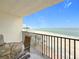 Balcony showcasing outdoor seating with scenic views of the beach and ocean at 12924 Gulf Blvd # 503, Madeira Beach, FL 33708