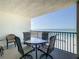 Relax on this covered balcony with table and chairs and enjoy views of the ocean and the beach at 12924 Gulf Blvd # 503, Madeira Beach, FL 33708