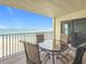 Balcony features outdoor seating with ocean and beach views at 12924 Gulf Blvd # 503, Madeira Beach, FL 33708