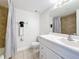 Clean bathroom featuring a white vanity and a tiled shower with a gray shower curtain at 12924 Gulf Blvd # 503, Madeira Beach, FL 33708