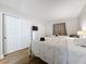 Bright bedroom features two beds, closet, dresser, and natural light at 12924 Gulf Blvd # 503, Madeira Beach, FL 33708