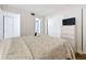 Cozy bedroom with a TV, closet, and ensuite bathroom at 12924 Gulf Blvd # 503, Madeira Beach, FL 33708