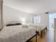 Bright bedroom features two beds with white wicker headboards and seashell themed bedding at 12924 Gulf Blvd # 503, Madeira Beach, FL 33708
