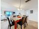 Dining area offers open layout with an ocean view from sliding glass doors at 12924 Gulf Blvd # 503, Madeira Beach, FL 33708