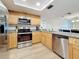 The modern kitchen includes stainless steel appliances and plenty of counter space, great for cooking at 12924 Gulf Blvd # 503, Madeira Beach, FL 33708