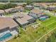 Overhead view of several homes featuring backyard pools, screened lanais, and outdoor seating areas at 13069 Paddock Wood Pl, Riverview, FL 33579