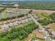 Beautiful aerial view of homes in a residential neighborhood, surrounded by mature trees and green spaces at 13069 Paddock Wood Pl, Riverview, FL 33579