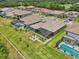 Wide angle of residences showing spacious outdoor living with pools, lanais, and lush landscaping for comfortable outdoor experience at 13069 Paddock Wood Pl, Riverview, FL 33579