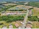 High-angle view of a Primary planned community boasting sidewalks, ponds, and meticulously manicured lawns at 13069 Paddock Wood Pl, Riverview, FL 33579