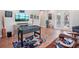 Spacious game room with a foosball table, console-themed rug, and large tv at 13069 Paddock Wood Pl, Riverview, FL 33579