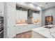 Stylish kitchen featuring quartz countertops, mosaic backsplash, and modern stainless steel appliances at 13069 Paddock Wood Pl, Riverview, FL 33579